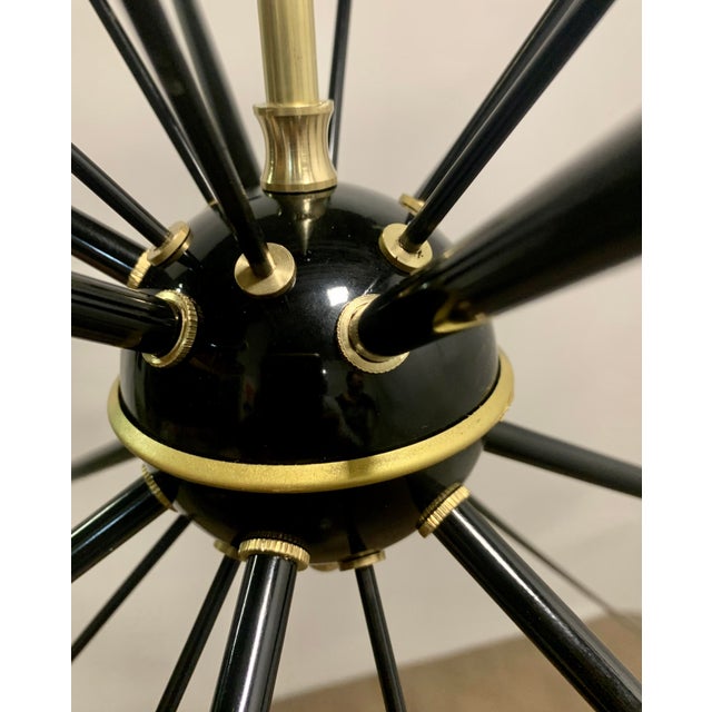 Rare Chandelier Model Sputnik in Brass with Colored Cones - 1950s Description: Authentic masterpiece of mid-century...