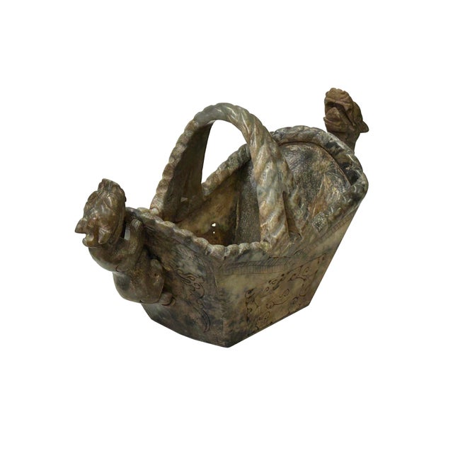 Discover an exquisite masterpiece with this meticulously carved cintage Chinese stone basket, an extraordinary collector's...