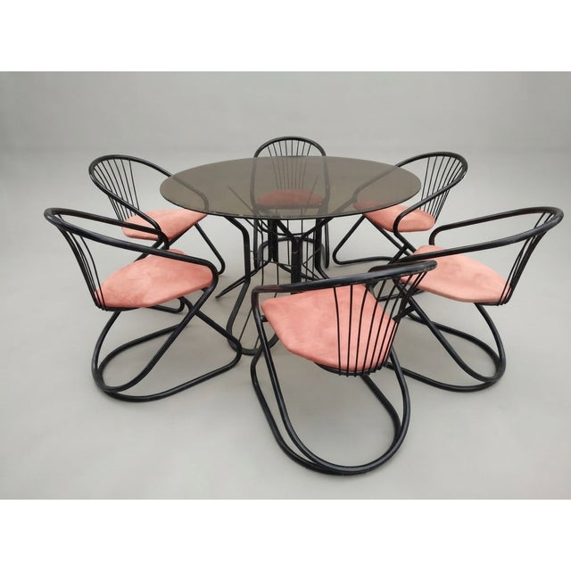 An exceptional and highly collectible 6-person dining set, reflecting the sophisticated design vision of Italian master...