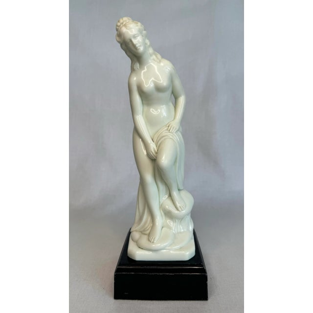 A tabletop statue of a woman inspired by classical sculpture; Venus. Perfect to give a touch of The feminine shape in...