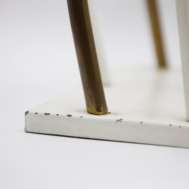 Circa 1940. We offer this Art Deco magazine rack, made in brass and wood.