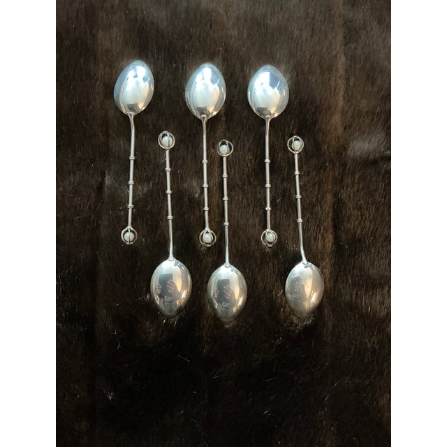 Japanese sterling silver teaspoons with pearl Finnys. Elegant and collectible, there are six with sleek, bamboo, stems and...