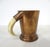 A hand-crafted beer or drink mug with stepped bottom and possibly a boar tusk handle made during the Mid-Century period....