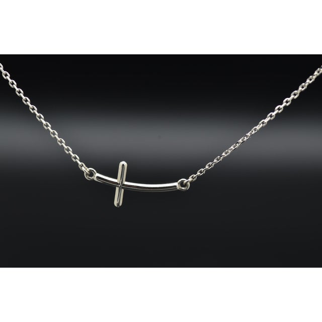 The Bevan Ladies 14K White Gold Cross Necklace. This necklace measures 18 inches in length and features an east to west...