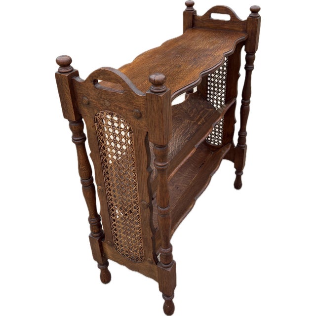 Lovely English book through shelf with cane sides and turned legs