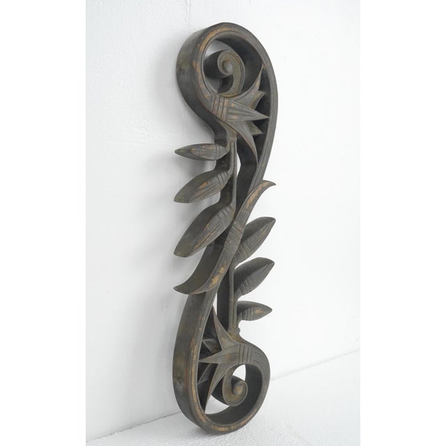 Art Nouveau style bronze metal piece with lugs on each side, suggesting it was likely from a gate, railing, or window...