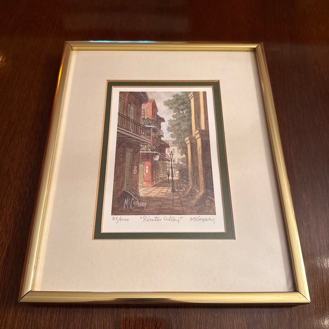 Custom framed lithograph prints, a pair, signed and numbered limited edition New Orleans architectural scenes by...