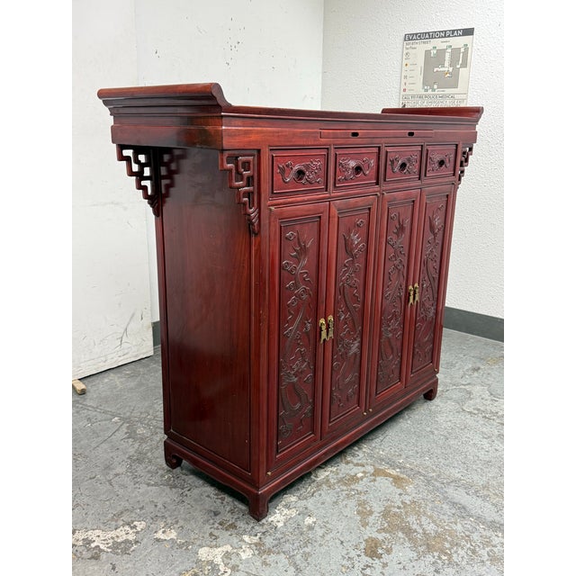 Design Plus Gallery presents a Four Door Rosewood Asian Cabinet. This vintage case piece showcases carved dragon motifs...
