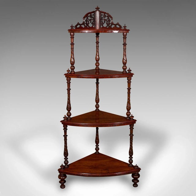 This is an antique corner whatnot. An English, walnut country house display stand, dating to the Victorian period, circa...