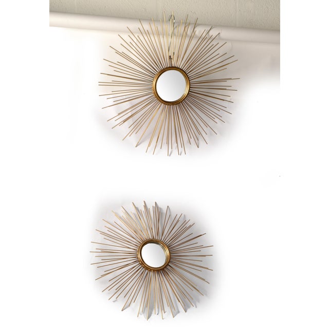 Set of two Francois Chaty Vallauris Style Accent Mirrors with a Sunburst Design, each featuring a round central flat...