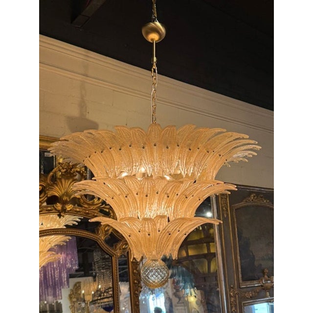 Modern Murano "palmette" chandelier in amber "granola" glass. A Murano palmette chandelier is a breathtaking fusion of...