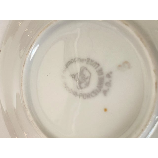 These are 3 pieces of a coffee service. The colors are pink and gold. 1 Sugar pot, 1 Coffee cup plate, I Tea or Coffee...