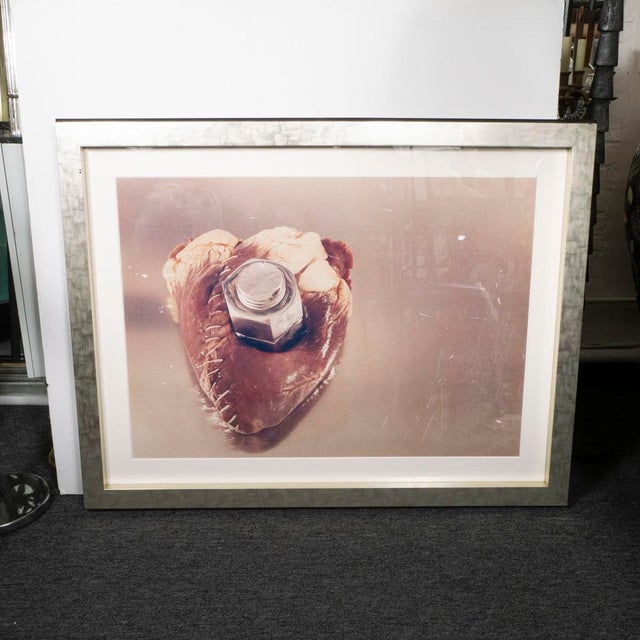 Large format Contemporary Postmodern Chromogenic Photograph depicting a human heart stitched and bolted together. Verso...
