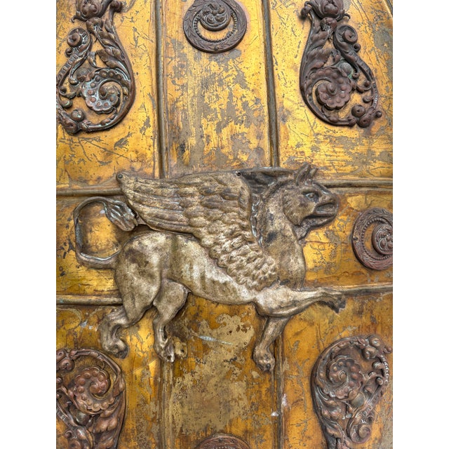 19th Century Brass Shield Shaped Griffin Wall Plaque. Height / 23.5 inches.