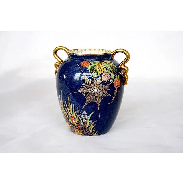 This vintage Carlton Ware vase in the hard-to-find Bleu Royale spider's web design is an exquisite piece of English...
