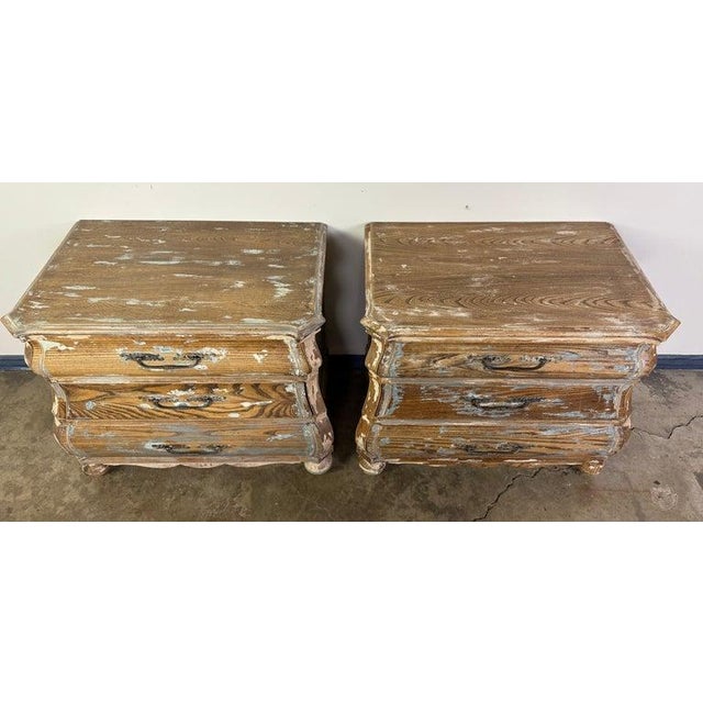 This charming pair of Louis XV style bombe chests brings timeless French elegance with a rustic twist. Featuring classic...