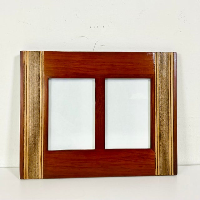 This is a lovely Mahogany wood picture frame from the 1980s. It hosts two 4" x 6" photos either side by side or one...
