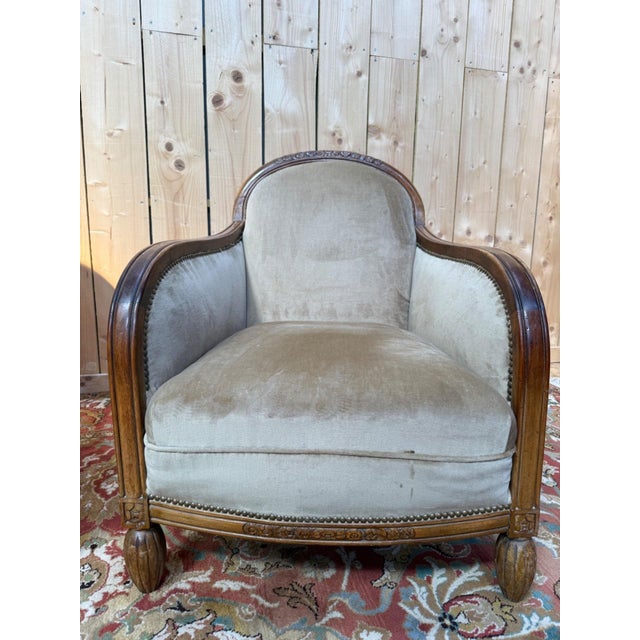 Pair of Art Deco period bergère armchairs in carved walnut and brown velvet. Seat height 38 cm