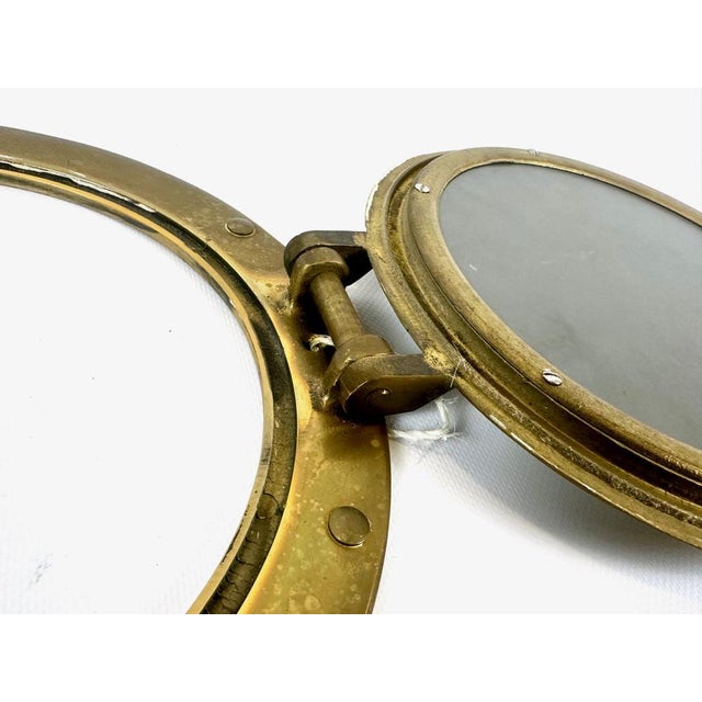 Ship Porthole Wall Mirror in Brass, 20th Century, in Flawless conditions. Designed before 1890