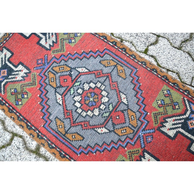 This is a vintage Turkish Oushak rug from the 1960s. The piece was hand-knotted.