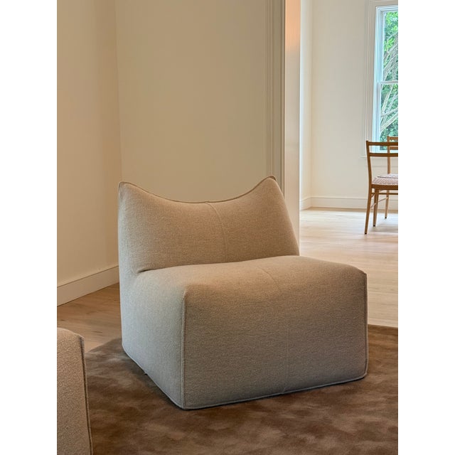 Offered is a pair of iconic Le Bambole armless lounge chairs designed by Mario Bellini for B&B Italia. Originally...