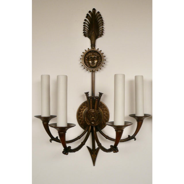 This handsome pair of signed Caldwell bronze sconces are in the neo-classical style. They feature Antique motifs including...