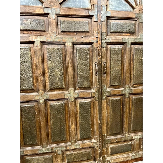 Make a dramatic first impression with these authentic antique brass-clad entry doors, masterfully handcrafted with...