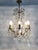 Vintage 8-Light Chandelier with Glass Drops. 1960s This beautiful chandelier with glass and bronze drops will look...