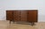 This magnificent mid-century Danish design sideboard credenza was designed by Ib Kofod-Larsen and manufactured by G-Plan...