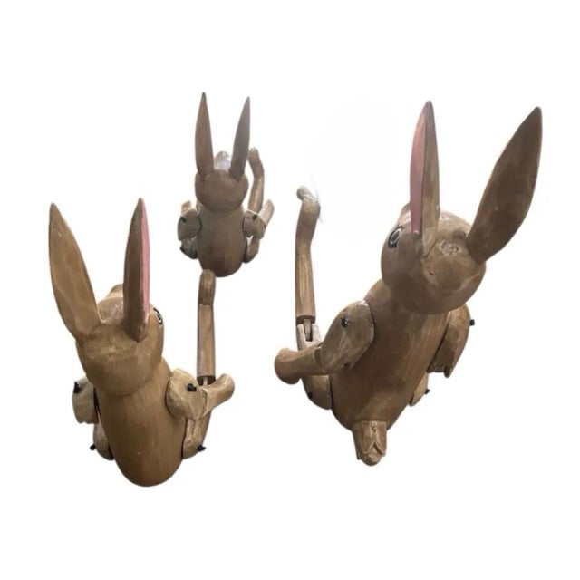 This delightful set of 3 hand-carved wooden rabbits adds a whimsical yet refined touch to any interior. Each figure is...