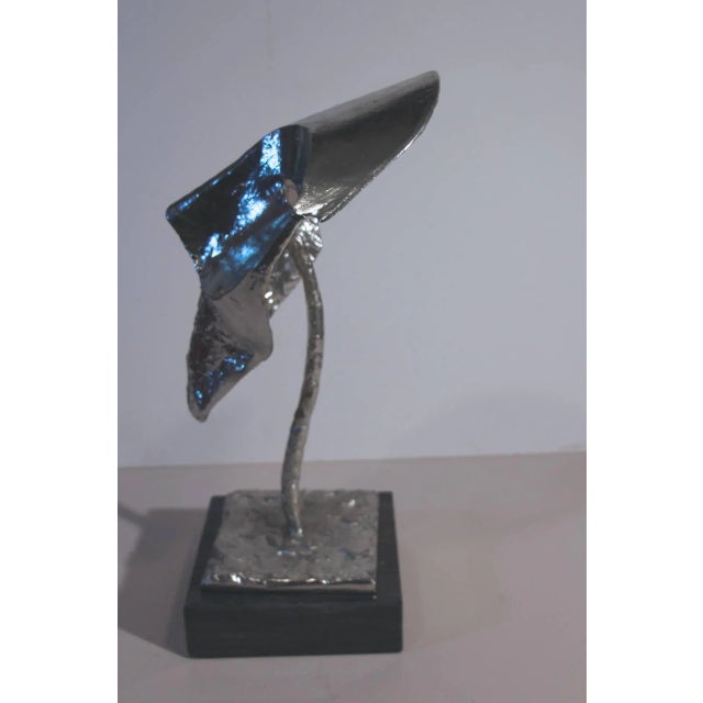 An unusual and intriguing case heavy metal bust mounted on a marble base. Well executed but no apparent signature.