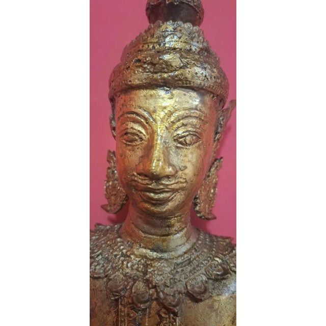 A figure made of brass or bronze (it is very heavy) with an aged patina. It is inspired by traditional Thai ethnic art. In...