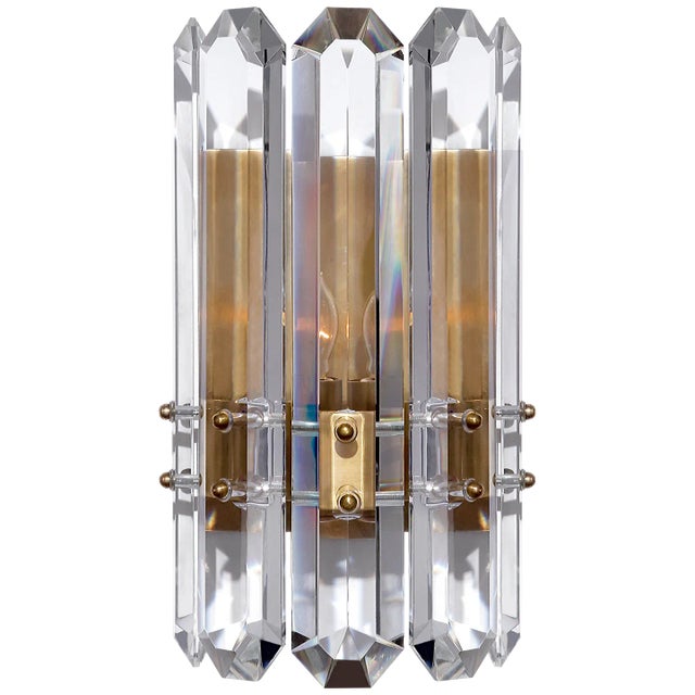 Bonnington Wall Sconce in Hand-Rubbed Antique Brass with Crystal Designer: AERIN Height: 12" Extension: 4.75" Backplate:...