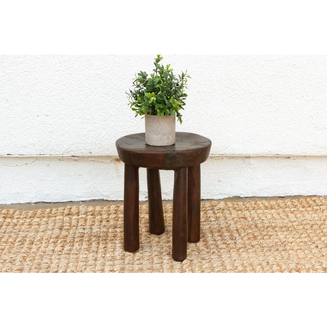 Add a touch of authentic African artistry to your home with this hand-carved milking stool. Handcrafted from a single log...