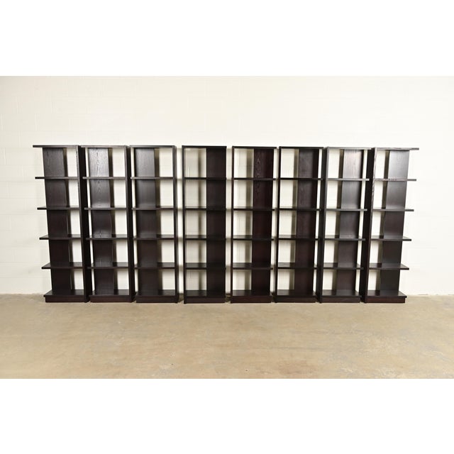 A gorgeous set of eight Modern Art Deco style dark oak modular bookshelves, étagères, or display units In the manner of...