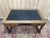 Louis XIII style flat desk in solid walnut and black leather with gilt tooling, opening to reveal two drawers. An elegant...