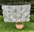 A vintage quilt in the French country tradition, printed with a classic black and white toile de Jouy pattern — pastoral...