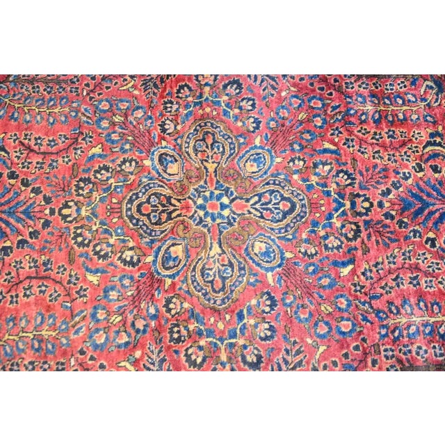 A wonderful early 20th century Persian Sarouk Maharajan rug with an exquisite all-over mirrored floral and tree-of-life...