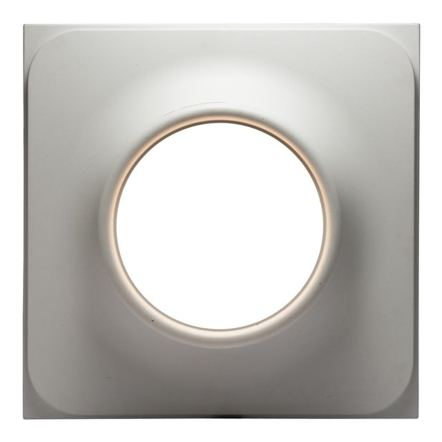 We are offering a very rare wall lamp from the 1970s by the renowned lighting company staff leuchten. a curved center...