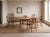 A round-topped dining table, crafted from solid oak and produced by Muebles Casablancas in Barcelona during the 1970s....