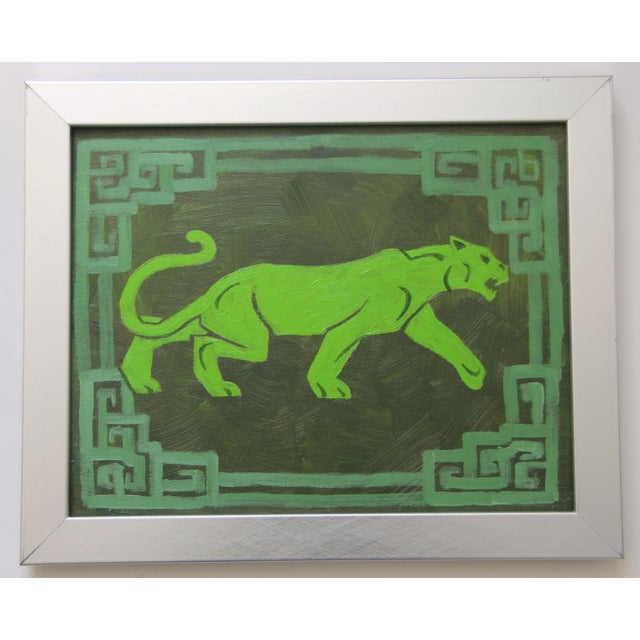 A panther or leopard silhouette in shades of army , forest, lime greens with a Chinese border. Art Deco, Abstract,...