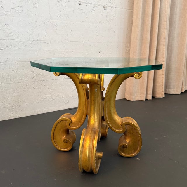 This exquisite 1970s Hollywood Regency side table showcases an artisan, hand-carved wood pedestal base finished in a...