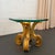 This exquisite 1970s Hollywood Regency side table showcases an artisan, hand-carved wood pedestal base finished in a...