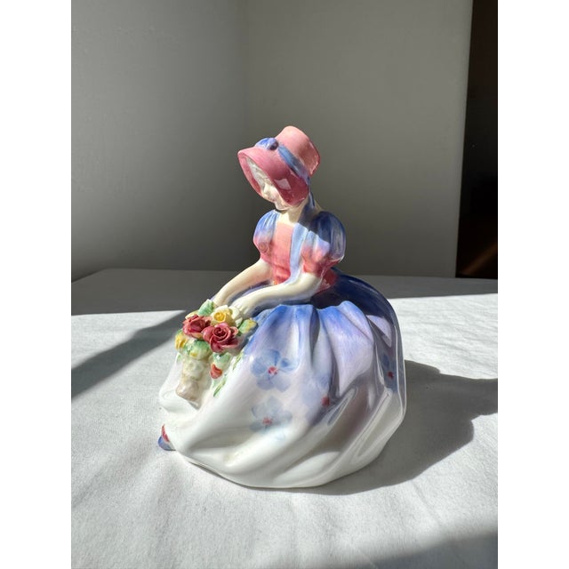 The Royal Doulton Figurine HN 1467 is an early Royal Doulton bone china figure, first introduced in the 1930s. Finely...