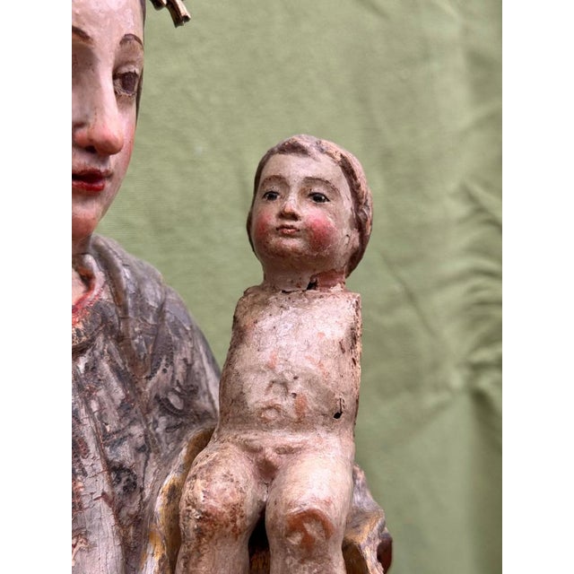 Virgin of La Antigua with Child, polychrome wood carving with silver crown, 16th-17th century This ancient devotional...