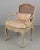 A Louis XV style French fauteuil, or arm chair, made of solid carved beech wood with verdigris painted finish and hand...