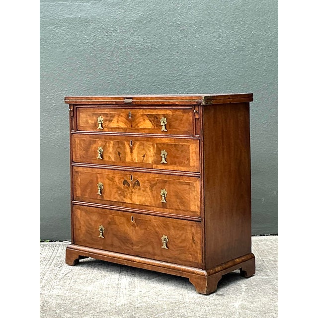 This exquisite George III style bachelor's chest is a testament to timeless English design and fine cabinetry. Crafted...