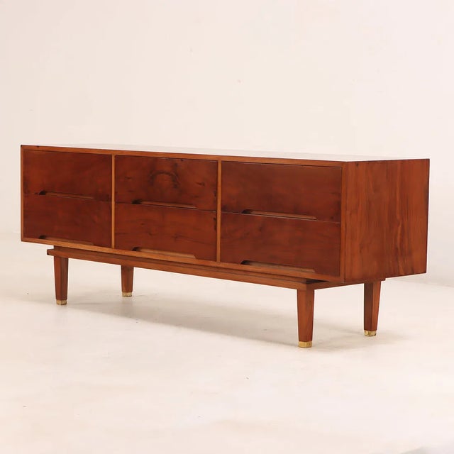 Clean and simple mid-century modern walnut credenza/dresser with stunning wood grains. This piece packs a punch—from its...