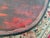 Asian, possibly Japanese, low table finished in red and black with inlaid that looks to be mother of pearl. It's very low...