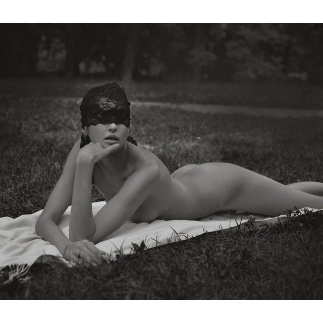 The Dreamer by Dasha and Mari A model lies in a Ukrainian garden, beauty beneath the veil. Limited edition print (edition...